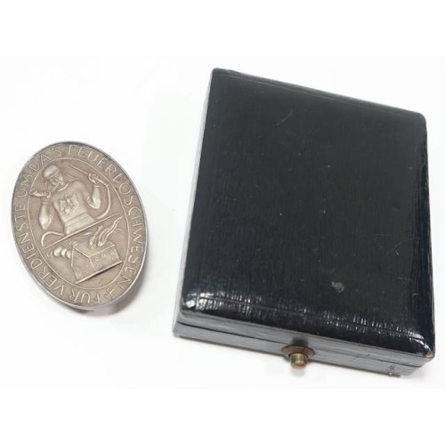 G263.)CASED FIRE FIGHTER'S SERVICE BADGE