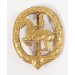 G567.)CASED EQUESTRIAN BADGE IN GOLD