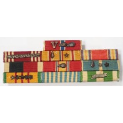 US579.)US ARMY 9-PLACE RIBBON GROUPING SPANNING THREE WARS