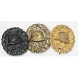 RD513.)SET OF THREE (3) 1936 SPANISH WOUND BADGES