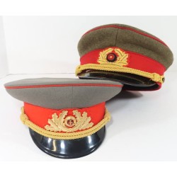 OC608.)TWO (2) EAST GERMAN VISOR CAPS