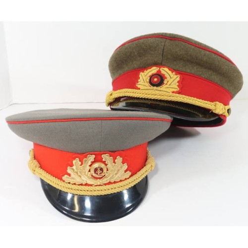 OC608.)TWO (2) EAST GERMAN VISOR CAPS